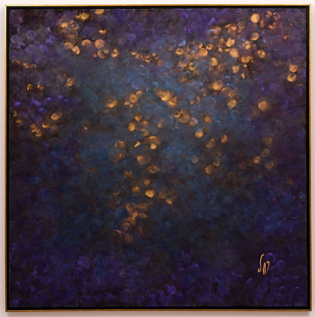 Abstract painting in deep indigo and violet, scattered with glowing amber circles of light in a sweeping band